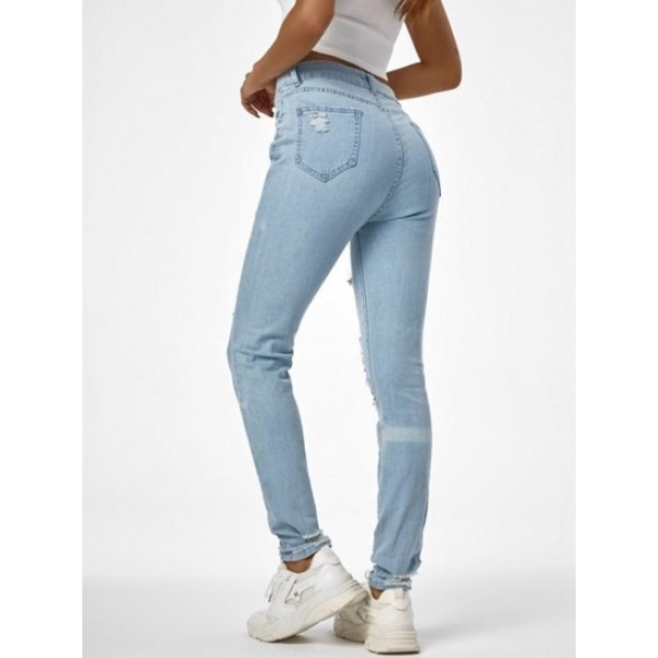 Shredded Distressed Light Wash Skinny Jeans